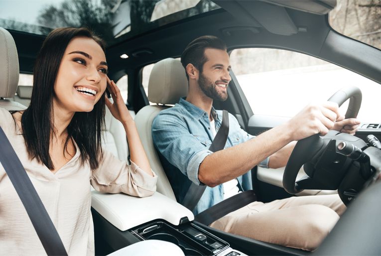 young couple in vehicle